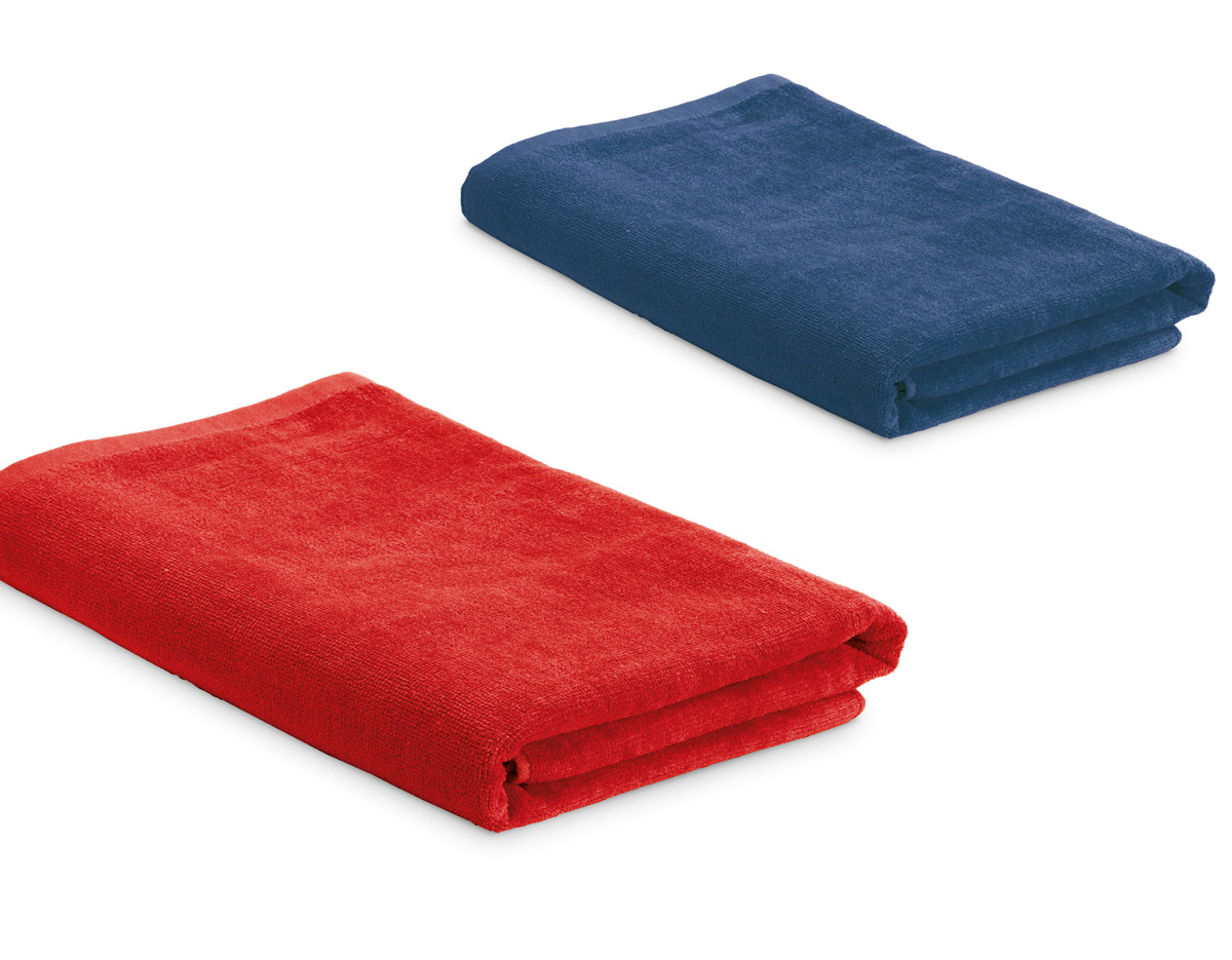Toalha de praia em veludo de algodão (320 g/m²), disponível em várias cores. Fornecida com sacola em non-woven (80 g/m²). 1500 x 750 mm | Sacola: 330 x 415 x 100 mm