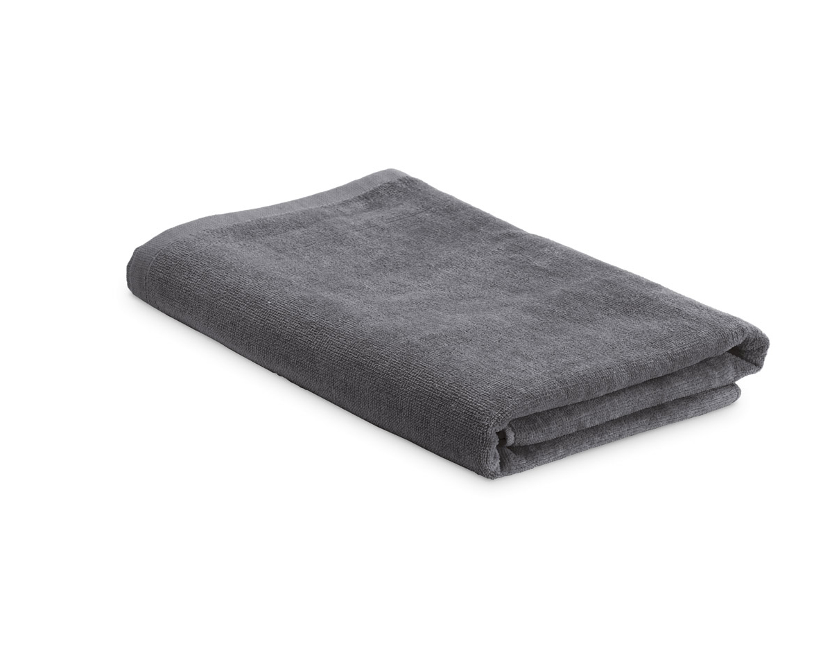 Toalha de praia em veludo de algodão (320 g/m²), disponível em várias cores. Fornecida com sacola em non-woven (80 g/m²). 1500 x 750 mm | Sacola: 330 x 415 x 100 mm
