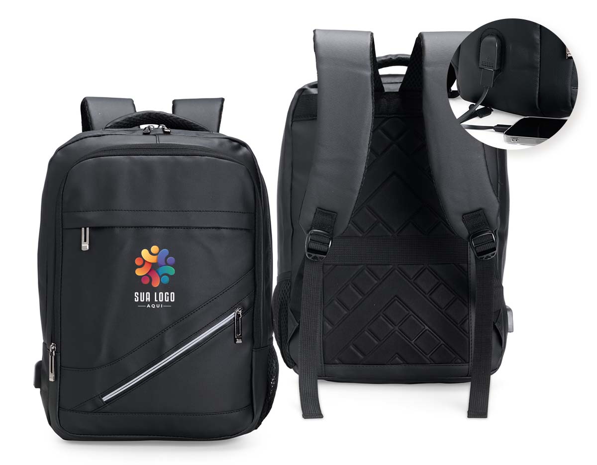 Leve tudo o que precisar para todos os lugares com esta mochila de 18 litros. Feita de couro sintético resistente à água, ela garante a proteção de tudo que há dentro da mochila contra chuva e respingos dágua. Além disso, ela possui dois bolsos na frente, um compartimento no meio que fica à frente da abertura principal e outro bolso lateral em rede para carregar garrafas ou guarda-chuvas. Por dentro, é possível guardar notebooks de até 15,6 polegadas e, em meio ao seu amplo espaço, há um extensor USB para fazer recargas com toda praticidade.