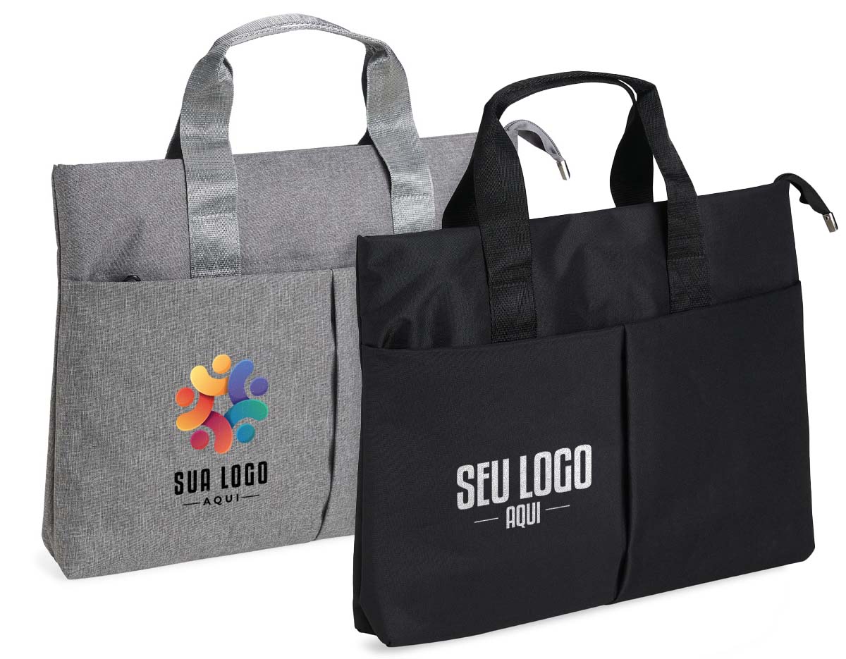 Pasta para notebook de 15 polegadas feita em poliéster resistente à água. Possui dois compartimentos: o principal, com bolsos internos para organização, e um frontal para itens menores.