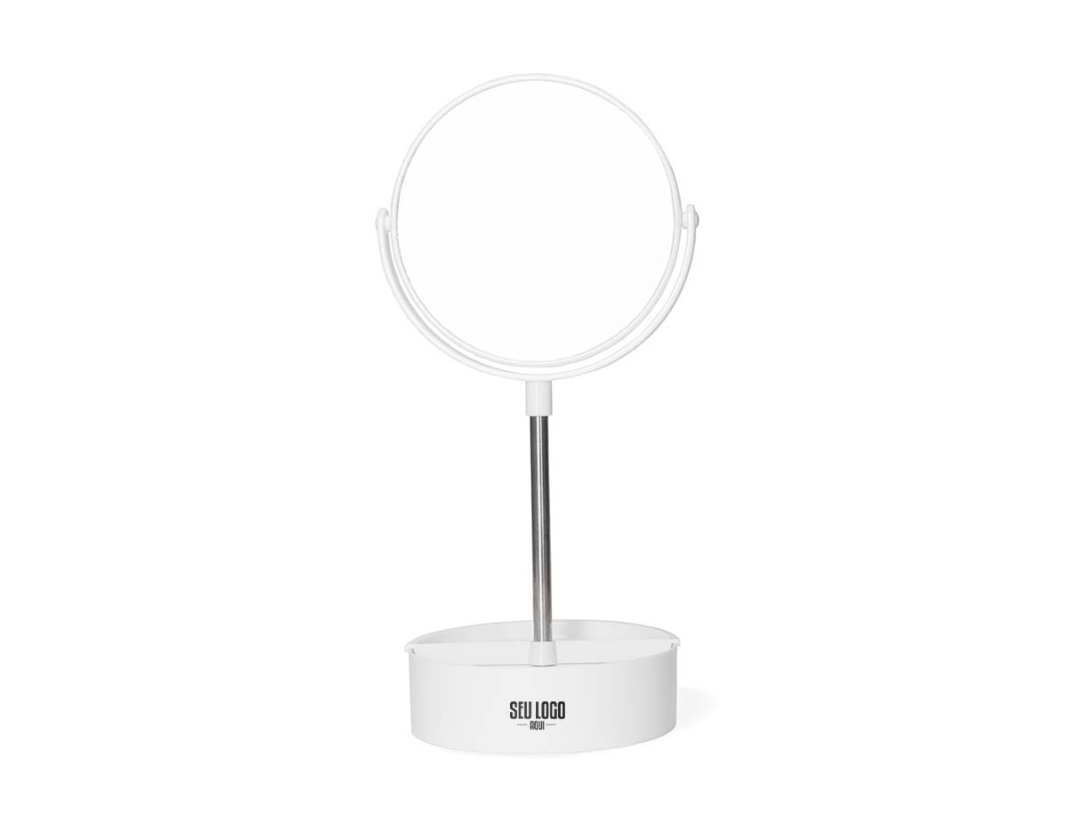 Espelho de mesa dupla face giratório com design moderno e funcional. Com base e moldura de plástico e pedestal de alumínio, ele é fácil de montar e adequa-se bem a qualquer ambiente. Sua base contém três divisórias para guardar objetos diversos.