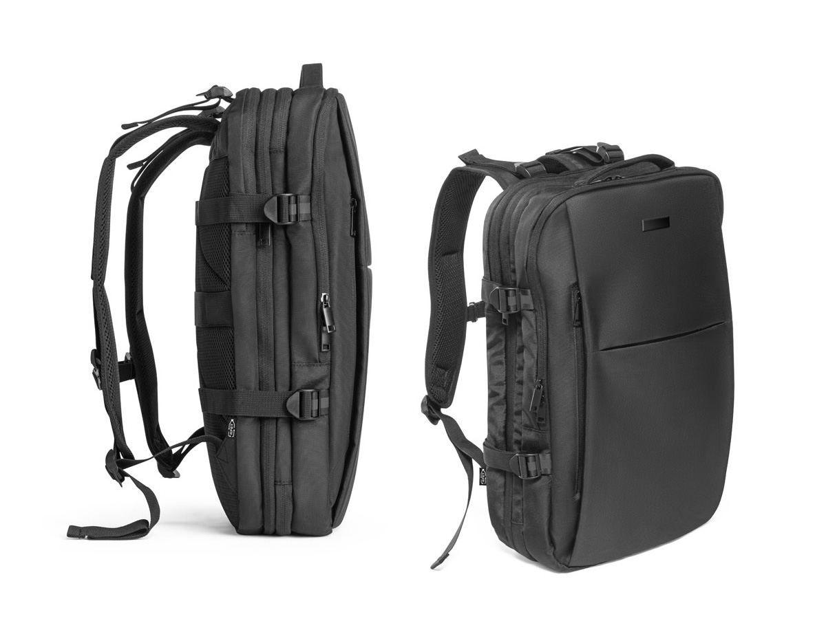 Mochila de viagem em poliéster reciclado 600D com acabamento repelente à água e forro em poliéster reciclado 210D. Possui três compartimentos principais: traseiro com bolsos para notebook até 17.3" e tablet até 10.1", central expansível para roupas e frontal com divisórias internas. Conta com três bolsos externos, dois com forro em PEVA, placa metálica removível, alças ajustáveis, cintas de compressão, pegas almofadadas e alça para trolley. Capacidade até 29 L.