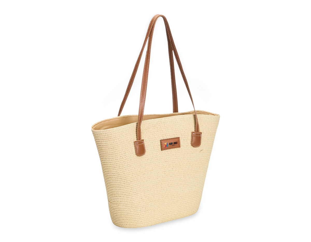 Bolsa confeccionada em fibra biodegradável de celulose, costurada com linha de nylon, unindo resistência e apelo sustentável. Possui fechamento em zíper e compartimento interno com bolso compacto para melhor organização. Conta ainda com alças e detalhes em couro sintético, incluindo plaquinha frontal costurada, que agregam sofisticação ao design. Um brinde corporativo moderno, ecológico e funcional, ideal para valorizar a marca com responsabilidade ambiental.